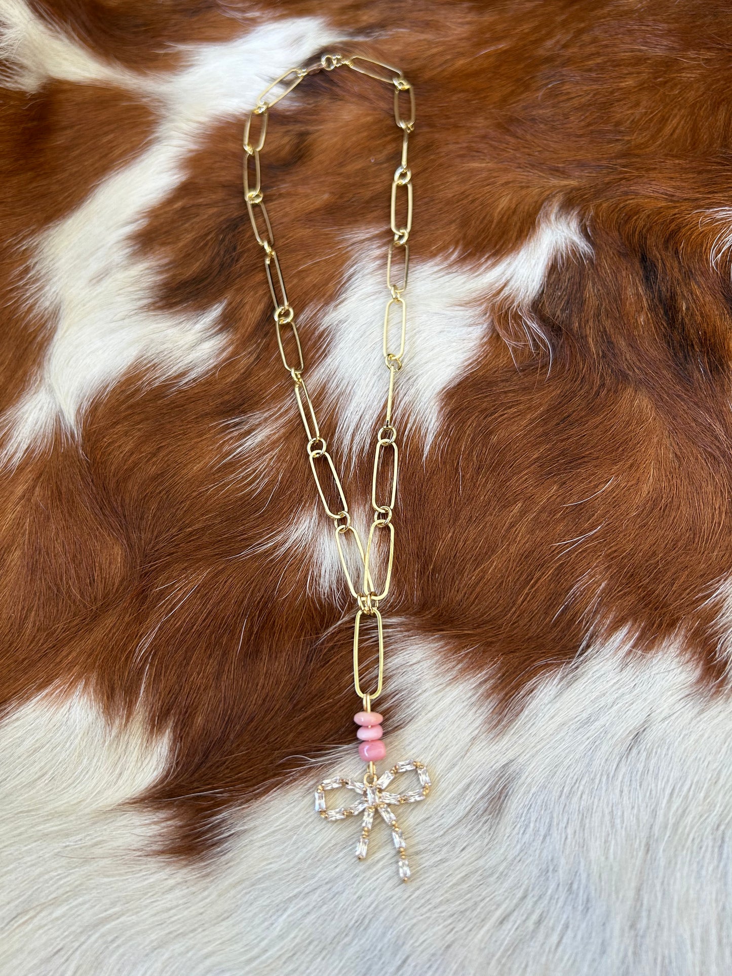 Pink conch gold bow