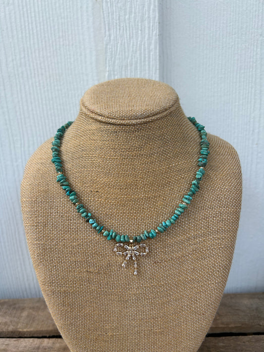 Turquoise and gold bow