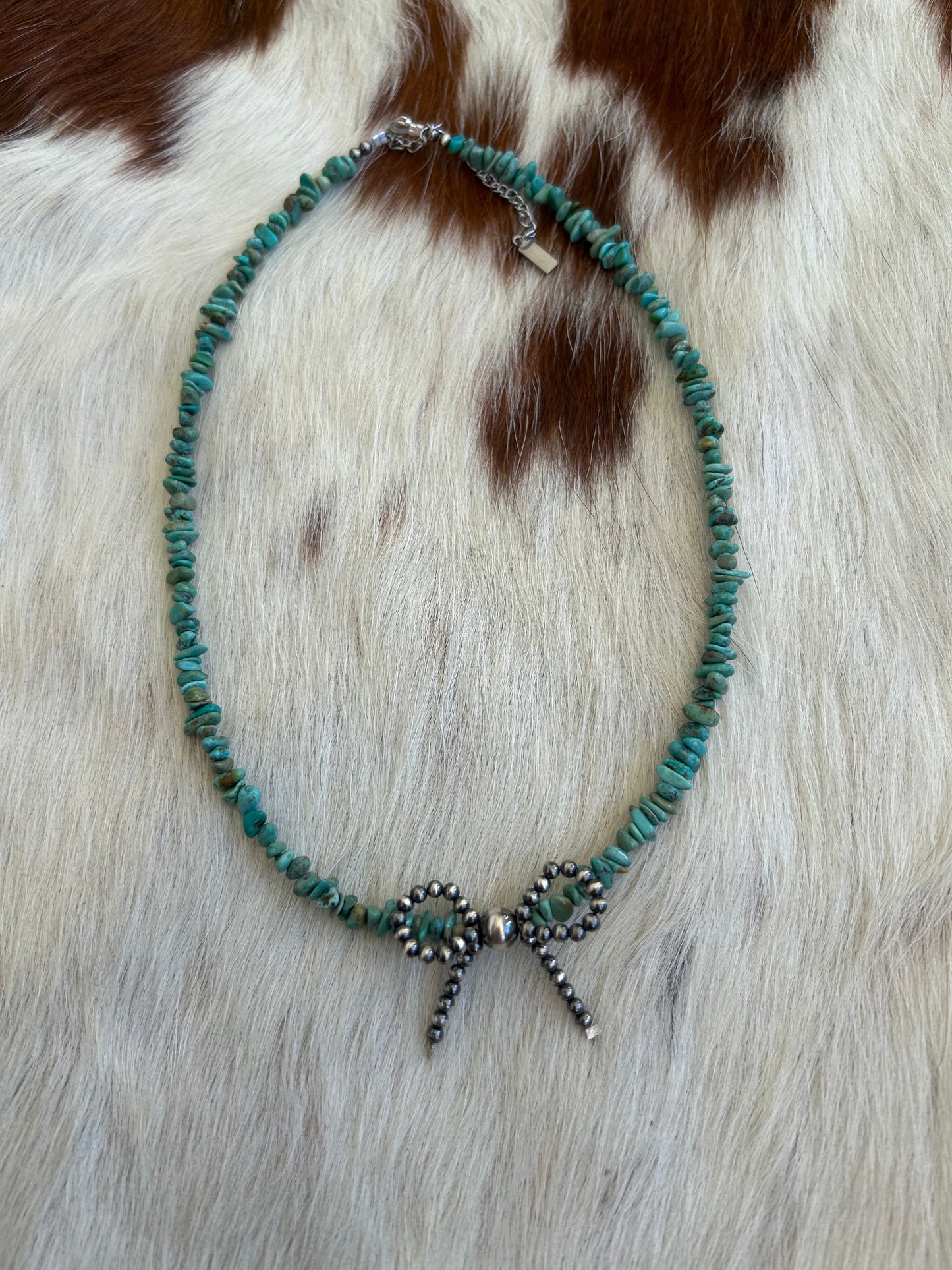 Turquoise with pearl bow