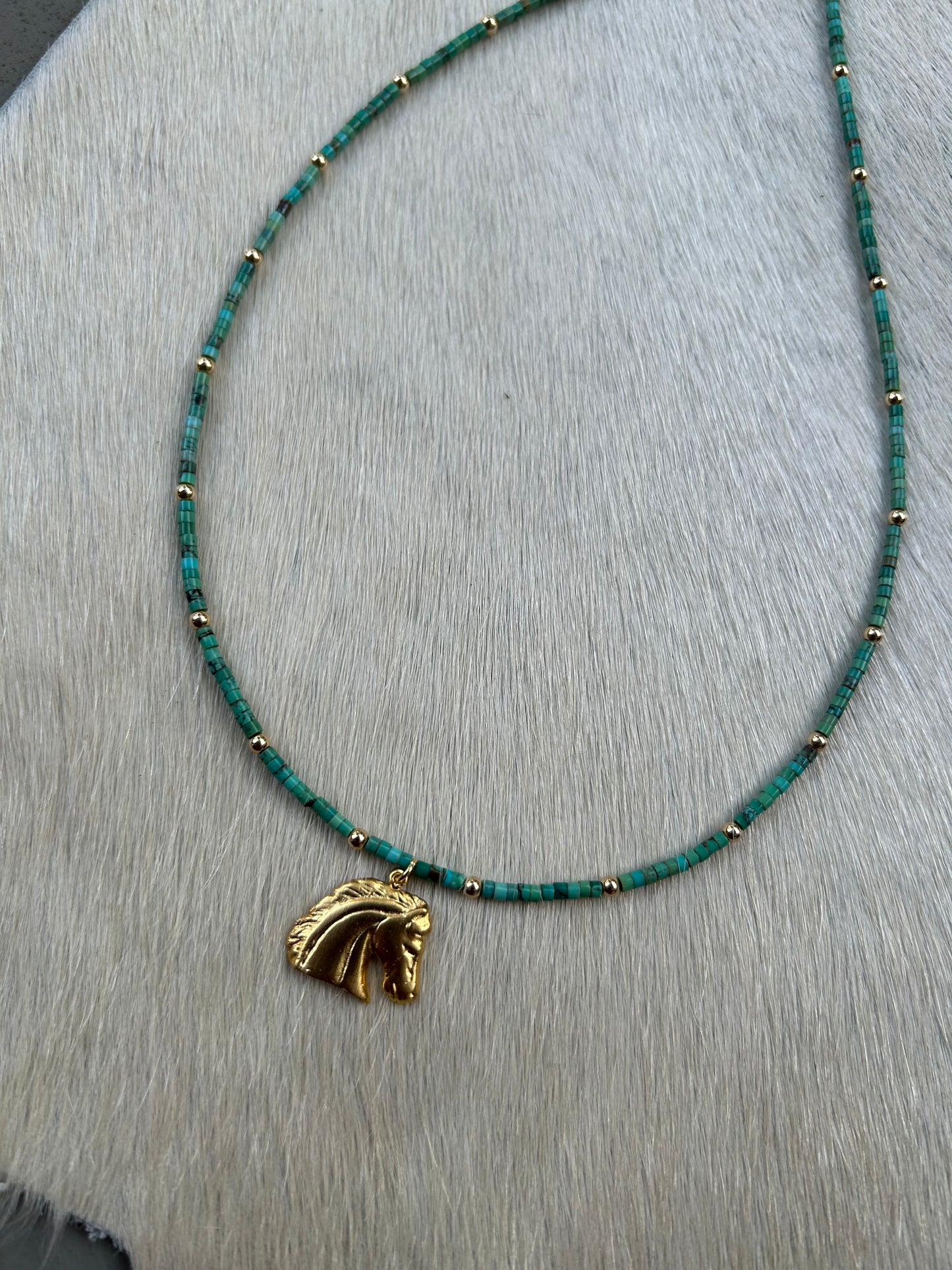 Gold horse charm