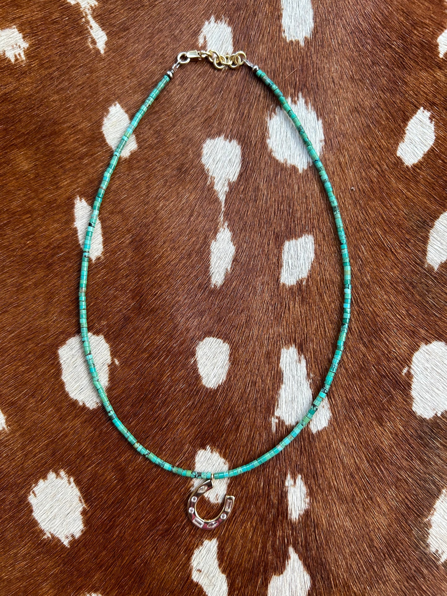 Small turquoise with gold horseshoe