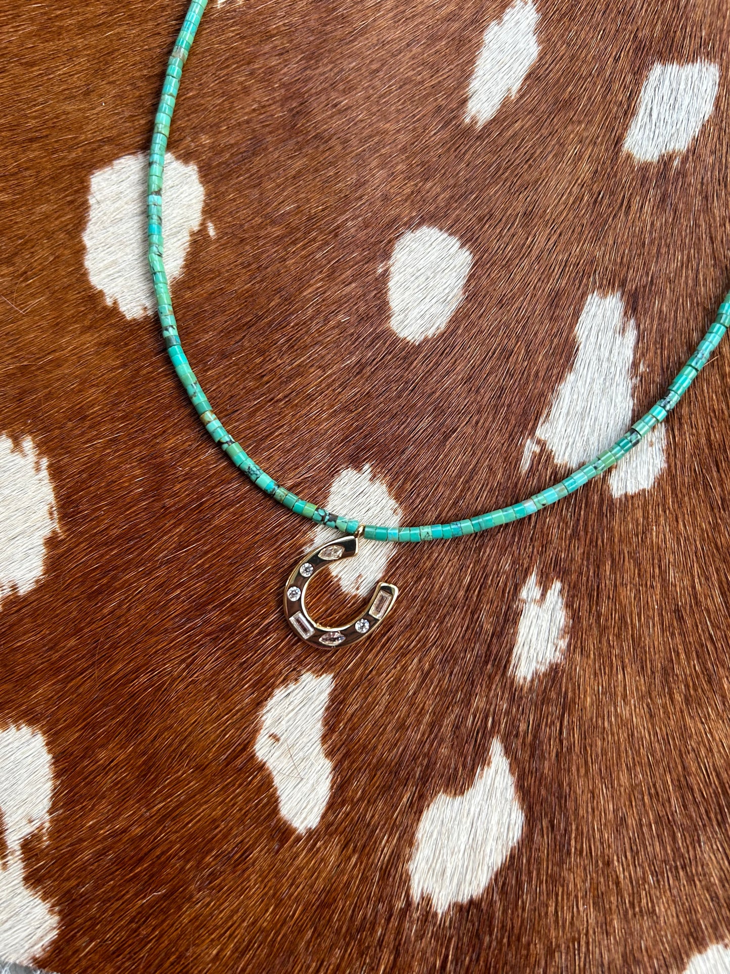Small turquoise with gold horseshoe