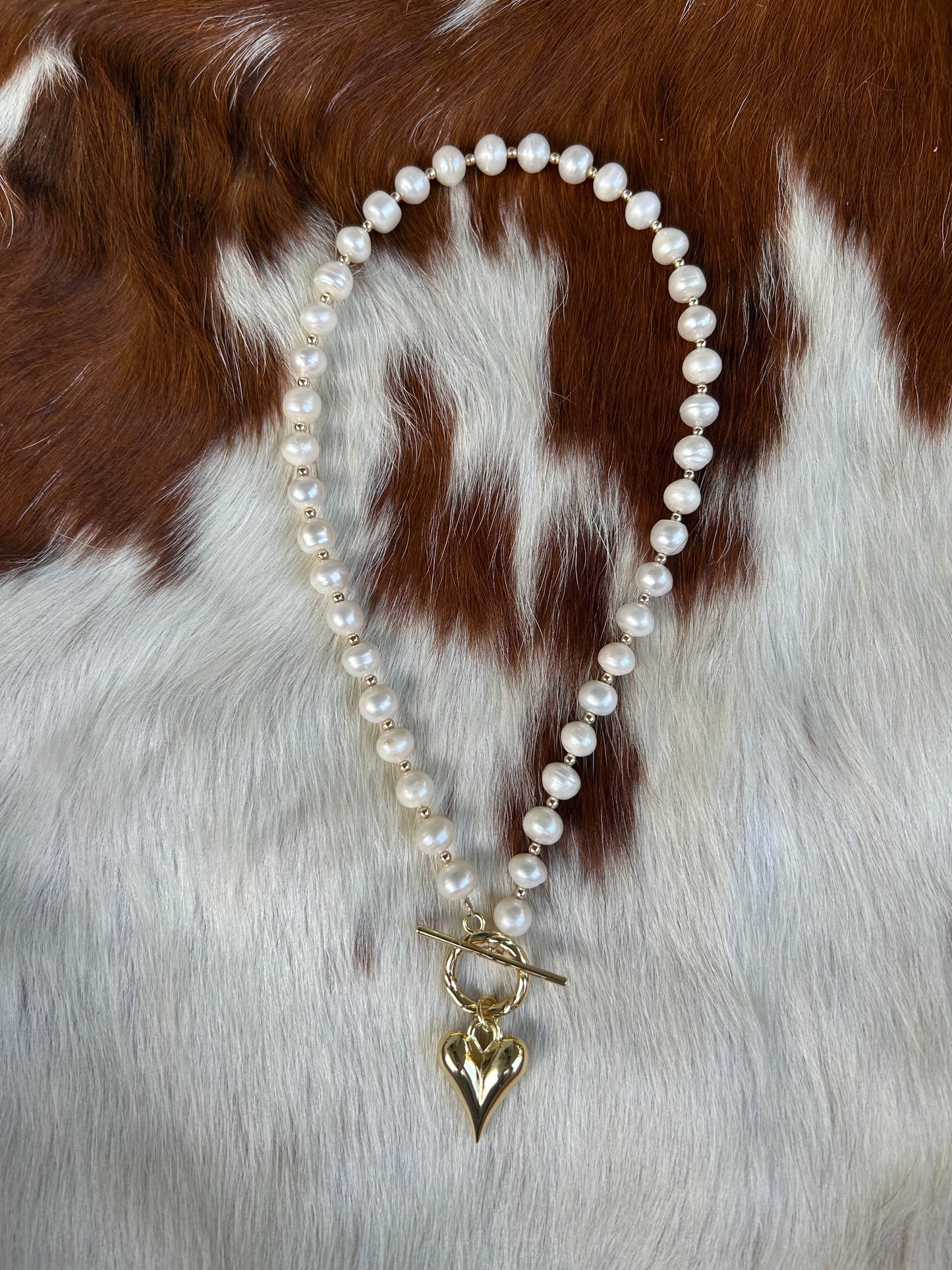 Gold pearls and heart