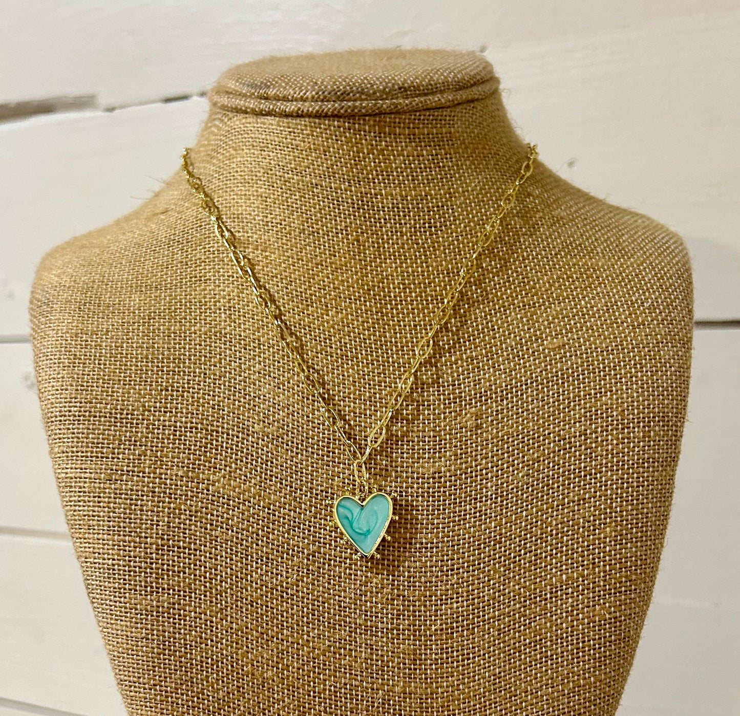 Gold paperclip and turquoise heart