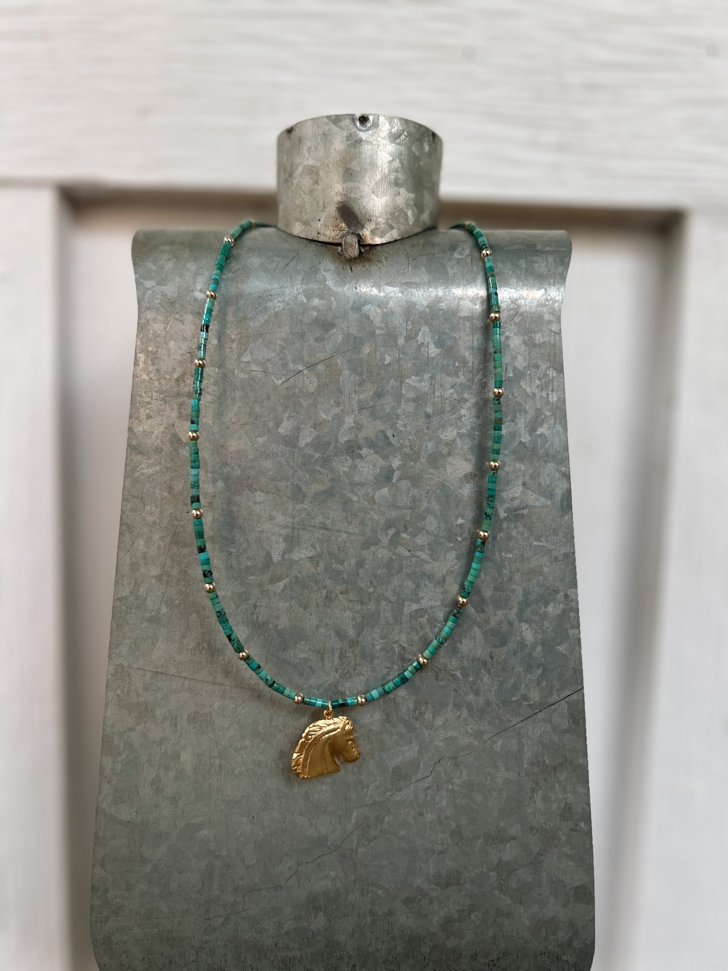 Gold horse charm
