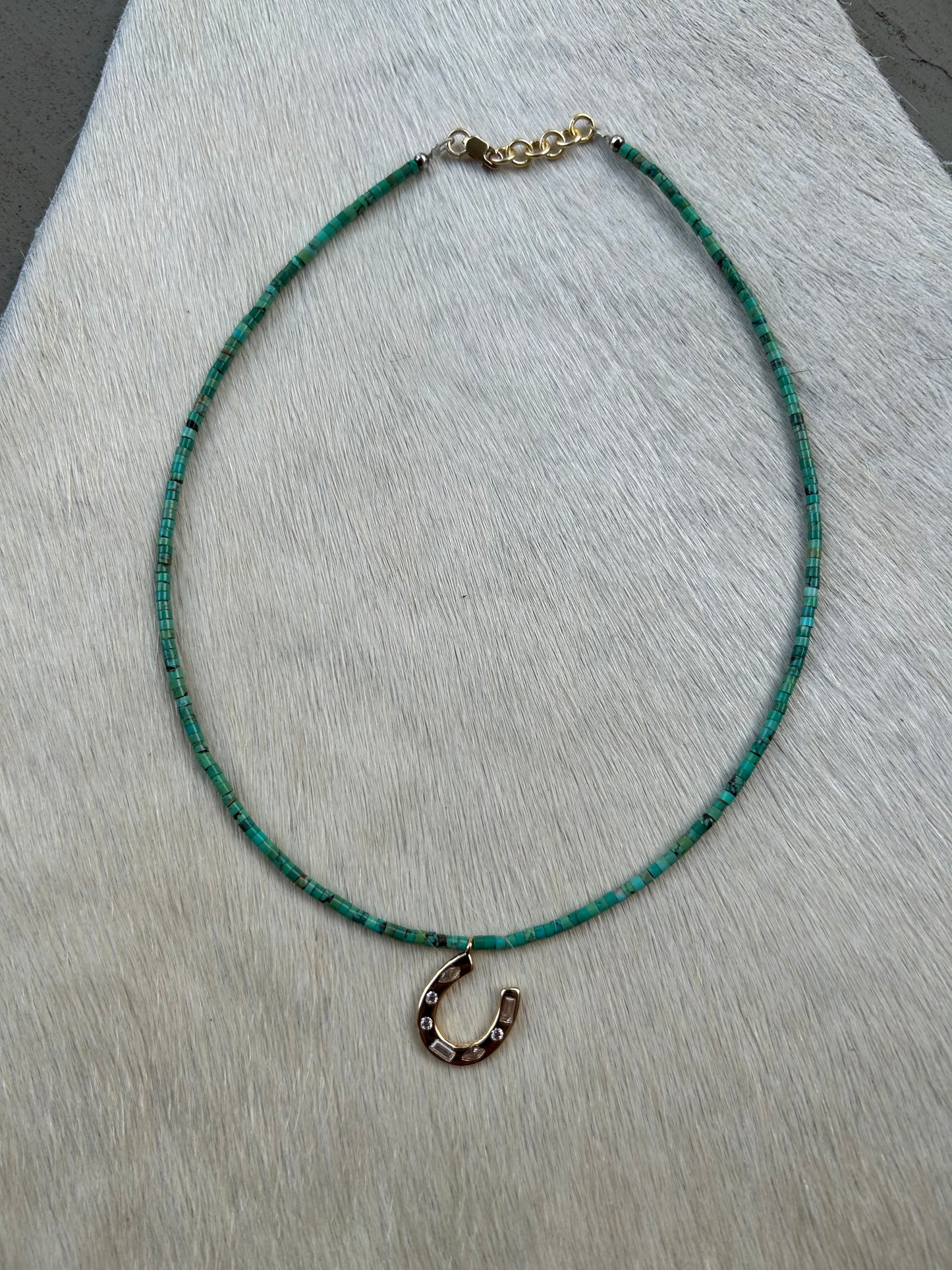 Small turquoise with gold horseshoe
