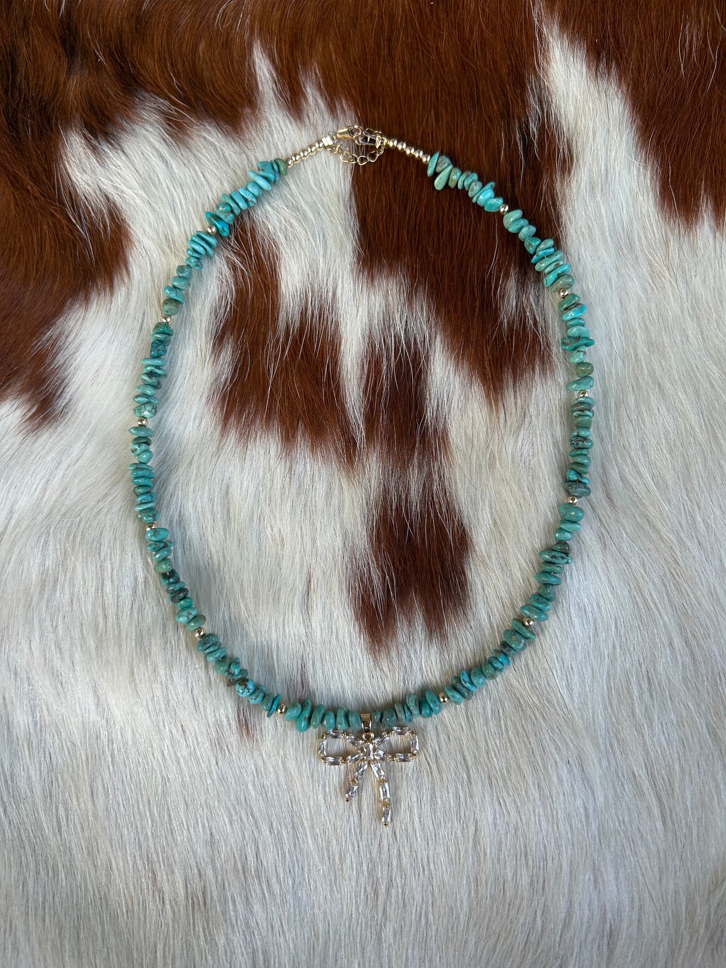 Turquoise and gold bow