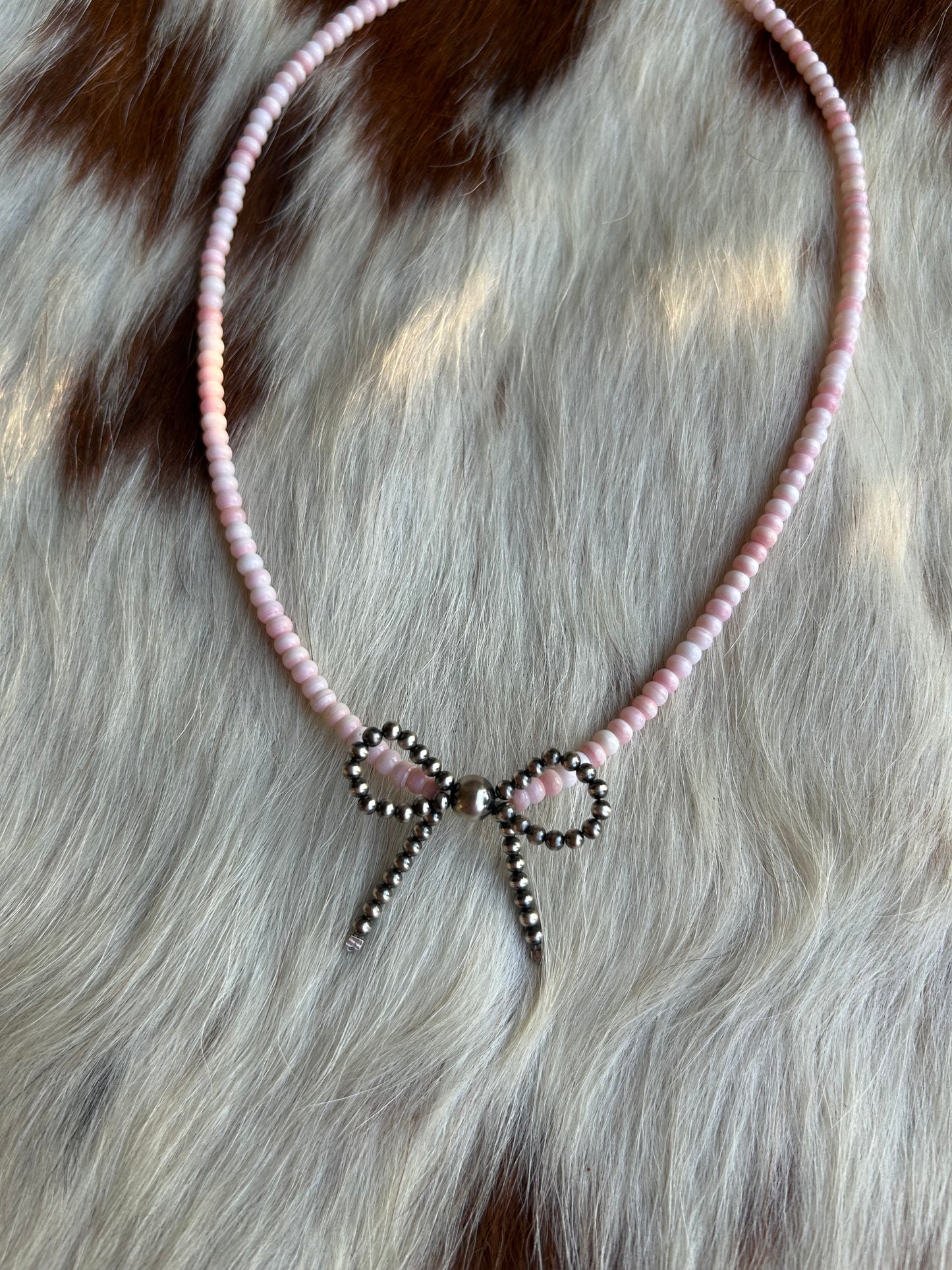 Pink conch bow