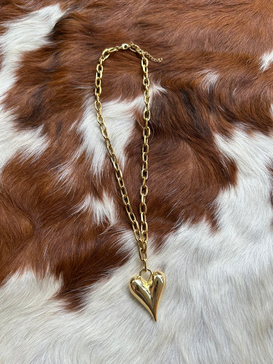 Gold paperclip and heart