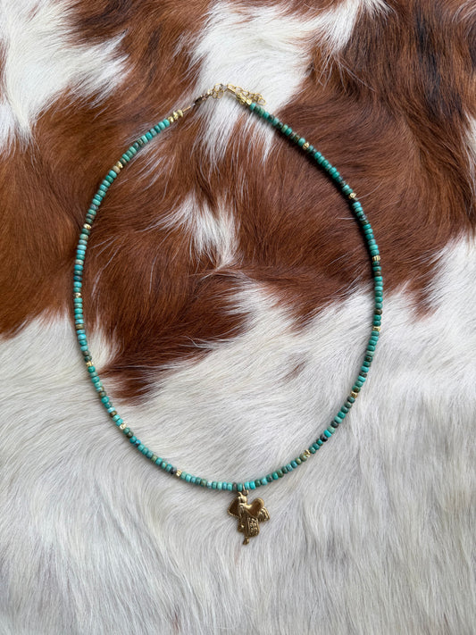 Turquoise and gold saddle charm necklace