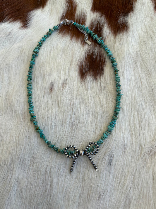 Turquoise with pearl bow