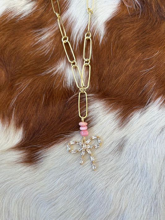 Pink conch gold bow