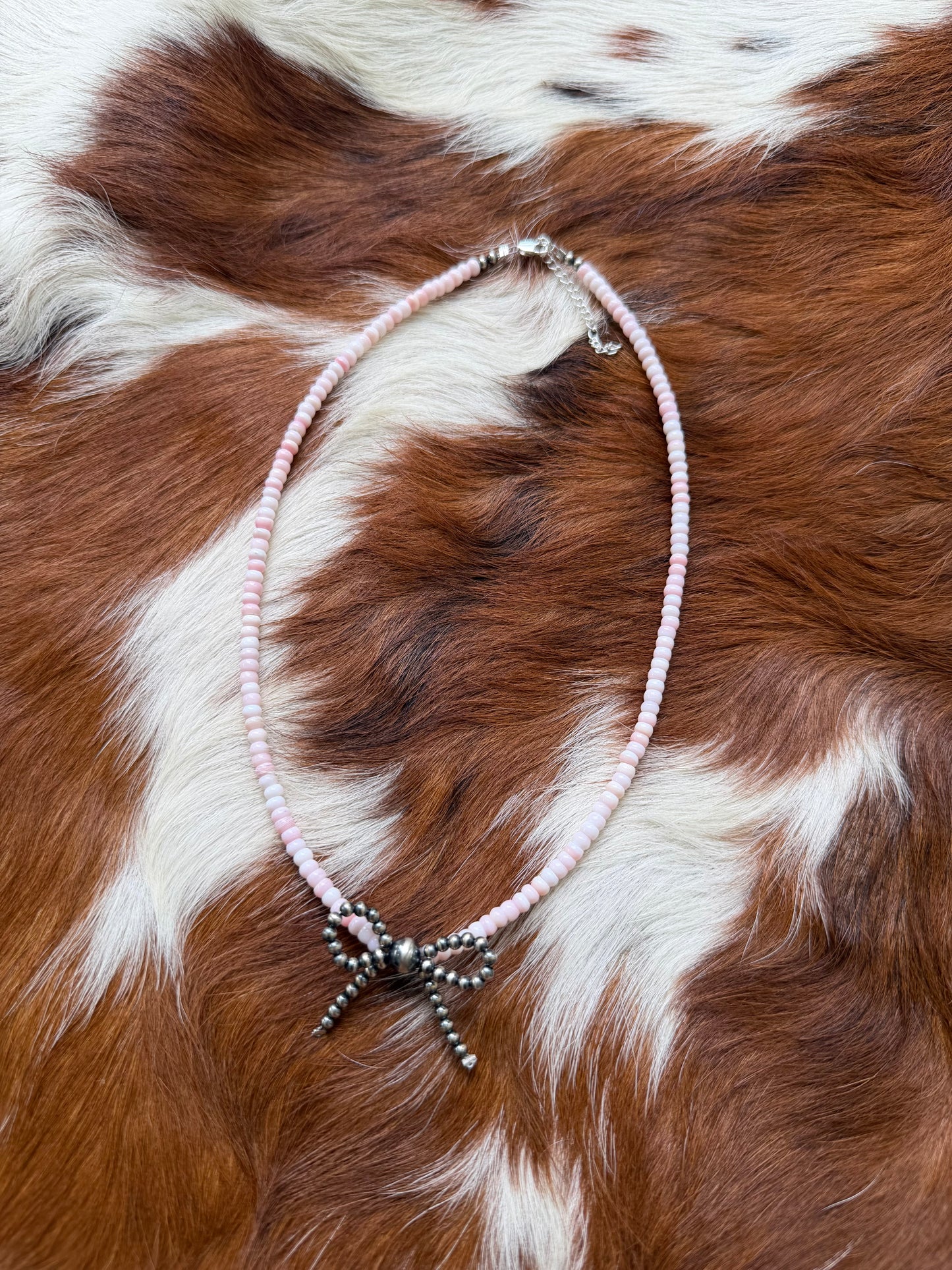 Pink conch & sterling pearl bow