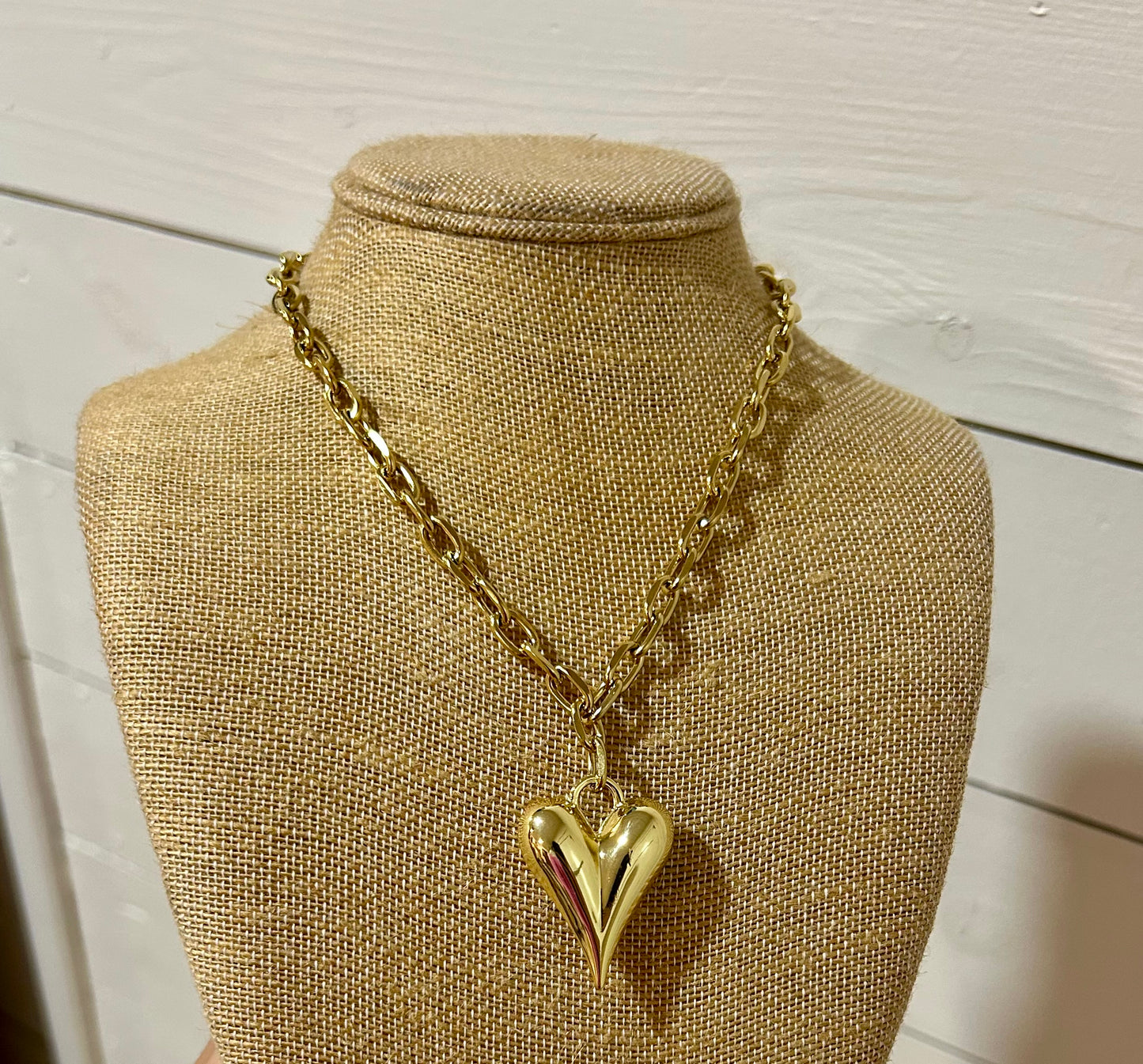 Gold paperclip and heart