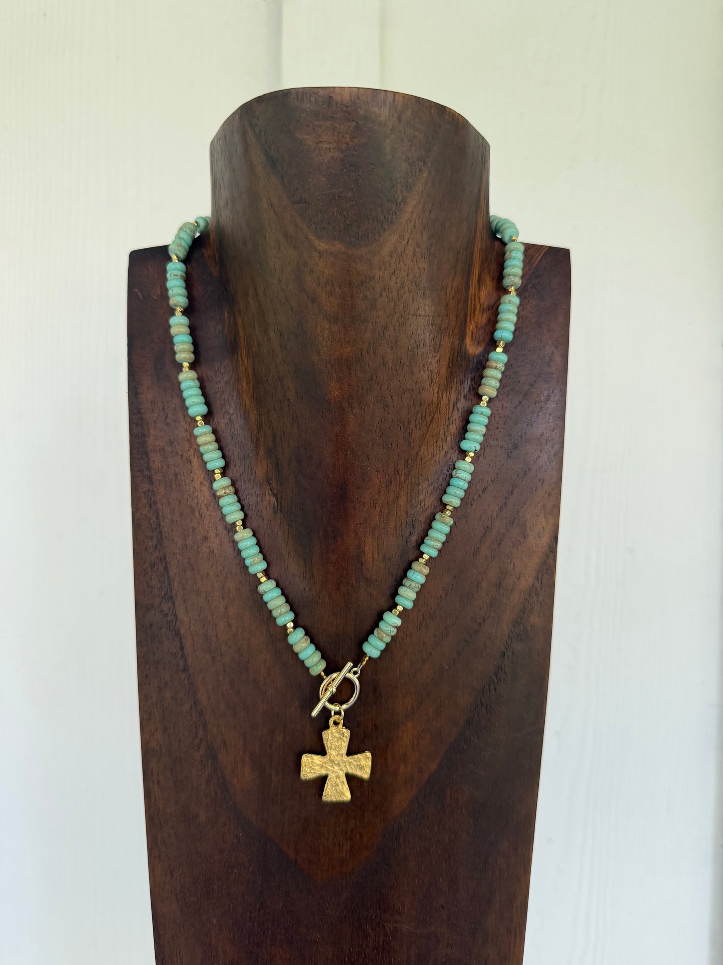 Faux turquoise rondelles and cross charm