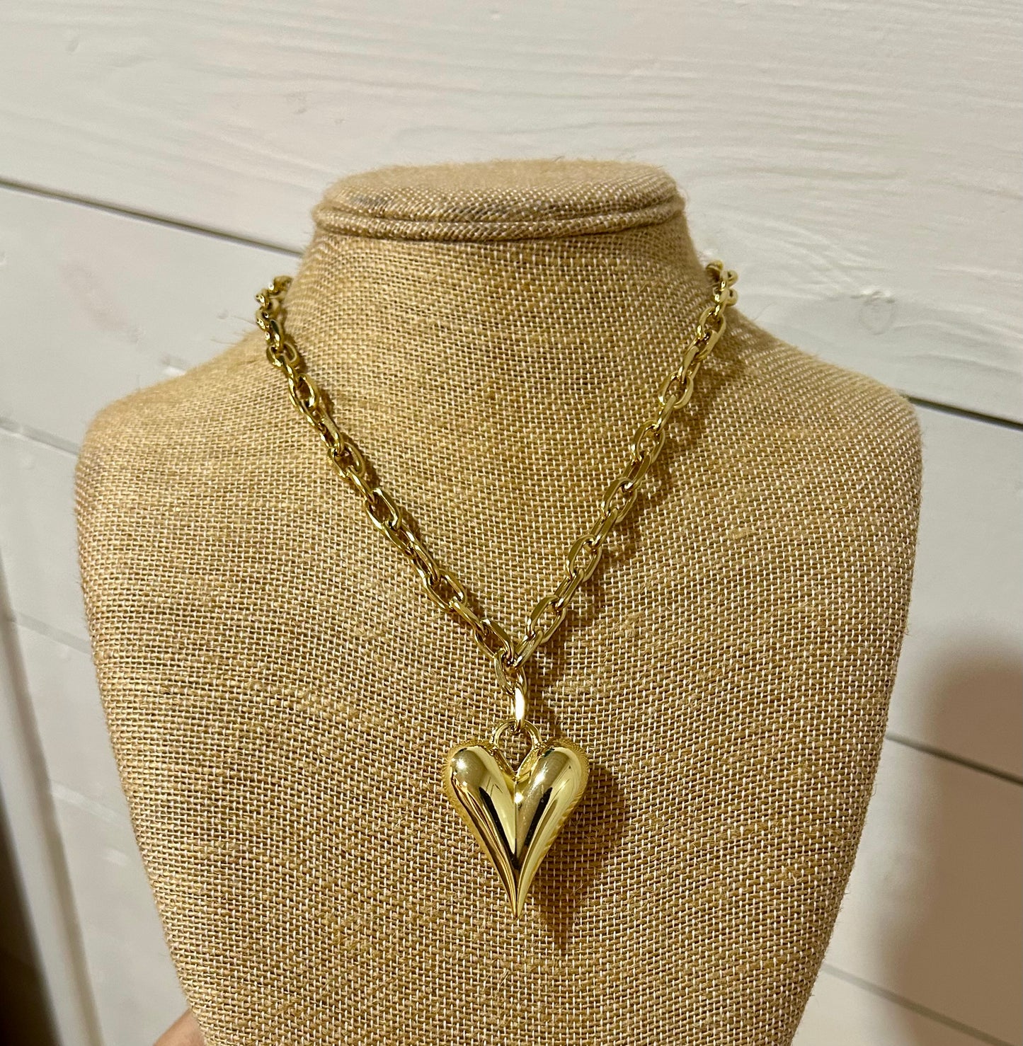 Gold paperclip and heart