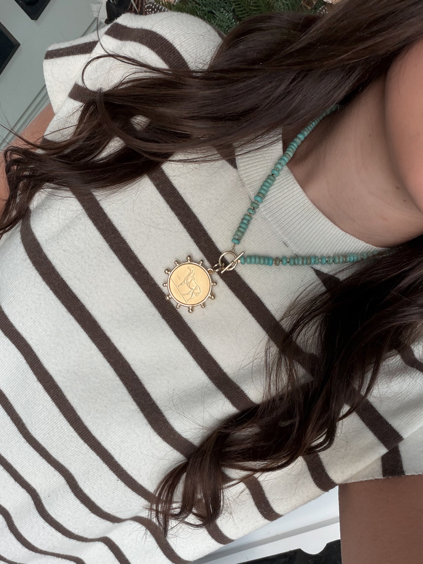 Faux turquoise and gold horse coin